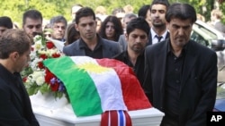 Mourners push the coffin of Bano Abobakar Rashid, 18, the first victim of the shooting rampage at Utoeya to be buried, during her funeral at a church in Nesodden on July 29.