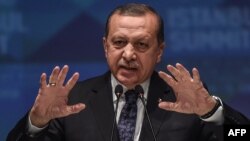 Turkey -- Turkish President Recep Tayyip Erdogan speaks during a press conference after the closing session of the 13th summit of the Organization of Islamic Cooperation (OIC) at Istanbul's Congress Center (ICC), April 15, 2016