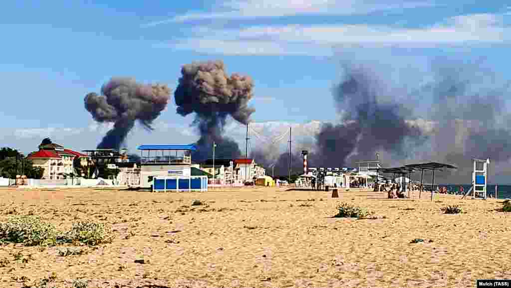 After a series of explosions, massive plumes of smoke erupted above the base.