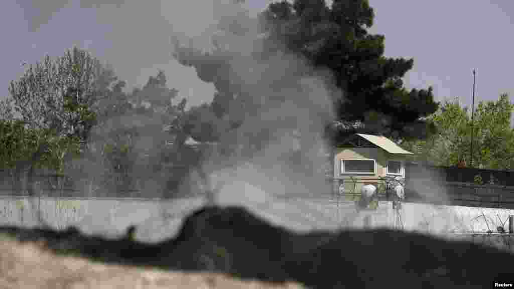 Smoke rises from a tower belonging to the British Embassy after gunmen launched the multiple attacks in Kabul. (REUTERS/Omar Sobhani)