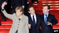 German Chancellor Angela Merkel, French President Nicolas Sarkozy and Russian President Dmitry Medvedev were expected to discuss European security questions at their summit in Deauville, France.