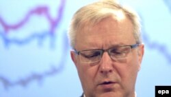 Comisarul UE pentru afaceri monetare Olli Rehn