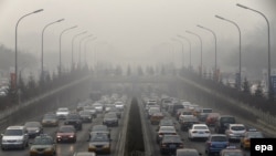 A main road leads into the haze in Beijing, China.