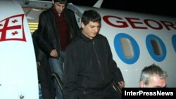Georgians deported from Russia arriving in Tbilisi in October 2006.