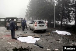 Cadavre în urma bombardamentelor de vineri 30 ianuarie în Donețk.