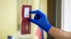 MOLDOVA -- A man shows his passport in a polling station at the Embassy of Russia in Moldova during voting in a referendum on amendments to the Russian Constitution in Chisinau, July 1, 2020. 