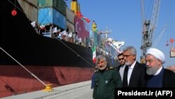 IRAN -- Iranian President Hassan Rohani (R) inaugurates the first phase of Chabahar (Shahid Beheshti) Port in the southern Iranian coastal city of Chabahar, December 3, 2017