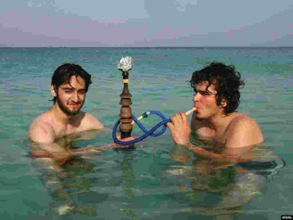 Iran, youth smoking hookah in the Caspian sea, north of Iran, undated