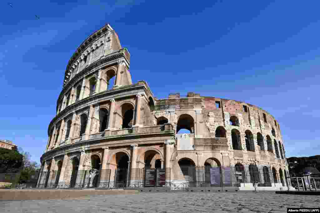 A general view shows a deserted and closed Colosseum monument in Rome on March 10, 2020 as Italy imposed unprecedented national restrictions on its 60 million people on March 10 to control the deadly coronavirus.
