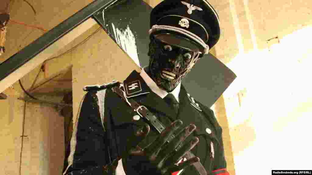 A detail from the eye-catching Nazi-themed installation "F**king Dinosaurs" by English brothers Jake and Dinos Chapman. 