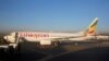 Workers service an Ethiopian Airlines Boeing 737-800 plane at the Bole International Airport in Ethiopia's capital Addis Ababa, January 26, 2017.