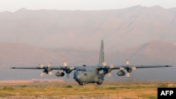 The C-130 Hercules transport plane is used extensively by the military to ship troops as well as heavy equipment and it is designed for taking off and landing on rough terrain. (file photo) 