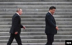 Си Цзиньпин и Владимир Путин в Пекине 25 июня
