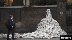 Piles on mannequin limbs are seen outside the Russian Embassy, as part of a protest against military action in Syria, in London on November 3.