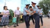 Kazakhstan - Law enforcement officers detain a man during a protest rally held by Kazakh opposition supporters in Almaty, Kazakhstan July 6, 2019. REUTERS/Pavel Mikheyev