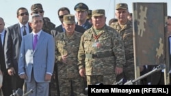 Armenian President and Supreme Commander-in-Chief of the Armed Forces Serzh Sarkisian (left) and senior military officials attend a dispay of the Armenian army's new weaponry during CSTO military exercises, Marshal Baghramian shooting ground, 19Sep2012