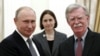 Russian President Vladimir Putin (left) meets with U.S. national-security adviser John Bolton in the Kremlin on October 23.