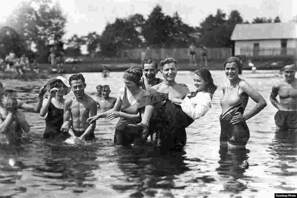 Many pictures are haunting for the juxtaposition of joyous images against the grim knowledge of what was to come. Areta Kovalsky, a Ukrainian-American living in Lviv, grew up listening to stories from her grandmother Bohdana, about Bohdana's younger sister, Maria (pictured here in 1936, being held above the water). The two were separated during World War II -- Bohdana fled for the United States, while Maria, a member of the Ukrainian Insurgent Army, was trapped in a city under heavy bombardment. Maria was later arrested for partisan activities and spent 15 years in prison. It would be 50 years before the sisters would see each other again. 