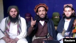 Omar Khalid Khorasani, center, a top Pakistan Taliban commander, gives an interview in Pakistan's Mohmand tribal region in 2011.
