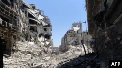 A handout picture released by the Syrian opposition's Shaam News Network on July 27, 2012 shows destruction in the Juret al-Shayah district of the central city of Homs.