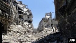 Хомс қаласындағы қираған үйлер. Сирия, 27 шілде 2012 жыл.