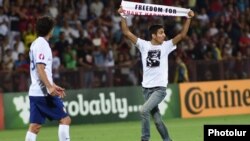 Armenia - Opposition activist Shahen Harutiunian invades the pitch during an Armenia-Portugal football game at the Republican Stadium in Yerevan, 13Jun2015.