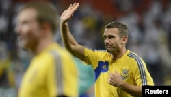 Andriy Shevchenko waves before the start of his team's Euro 2012 soccer match against England at Donbass Arena in Donetsk on June 19.