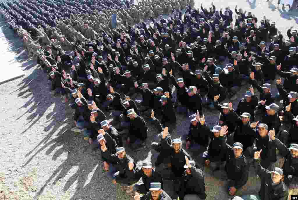 Afghan security officials attend their graduation ceremony in Herat. (epa/Jalil Rezayee)