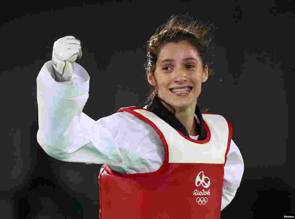 Patimat Abakarova of Azerbaijan celebrates after winning the women's taekwondo 49-kilogram bronze-medal bout.