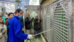 IRAN -- IRAN -- A man disinfects the shrine of Saint Masoumeh against coronavirus in the city of Qom, February 25, 2020