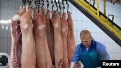 A worker at a meat processing plant in Brest, Belarus, December 2, 2014