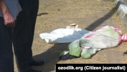Тело пожилого мужчины, попавшего под колеса автомобиля в Ташкенте.