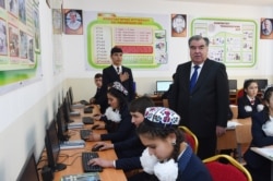 Tajik President Emomali Rahmon visits a school in the Rudaki district last year.