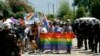 Montenegrin riot police accompany activists during a gay-pride parade in Budva on July 24.