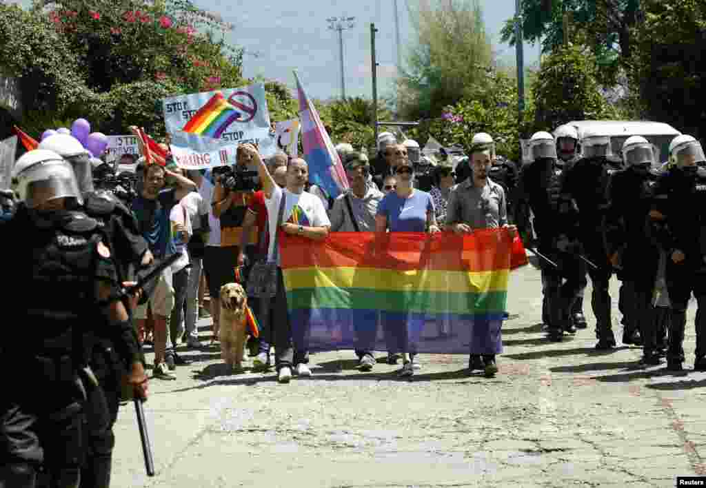 Montenegrin riot police protect activists during a gay-pride parade in Budva. Antigay protesters tried to disrupt the first gay-pride parade to be held in the staunchly conservative Balkan country, which is in talks to join the European Union. (Reuters/Stevo Vasiljevic)