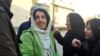 Iranian human rights activist, Narges Mohammadi (C), in front of Evin prison, undated.