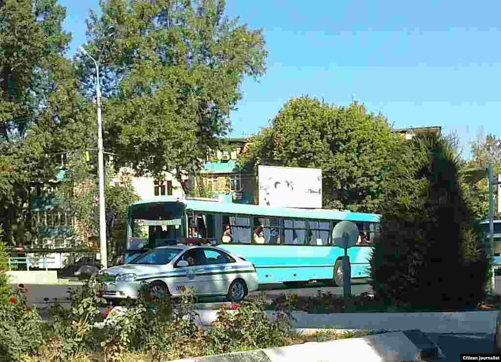 Some buses, like this one in the Sirdarya region, receive a police escort.