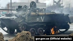 The bodies of Russian soldiers atop an armored vehicle after a battle in the Kyiv region.