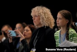 Сверхновая звезда экологического активизма Грета Тунберг и исполнительный директор Greenpeace International Дженнифер Морган на конференции в Мадриде
