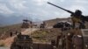 NATO and Afghan commando forces at a checkpoint in Deh Bala district in the eastern province of Nangarhar on July 7 