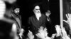 The leader and founder of the Islamic revolution, Ayatollah Ruhollah Khomeini, waves from a Tehran balcony during the country's revolution, in February 1979.