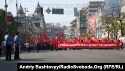 Police in the Ukrainian capital, Kyiv, watched as Communist Party supporters paraded on Labor Day in 2012.