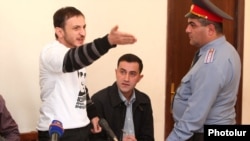 Tigran Arakelian gestures during his trial at the Court of Appeal in Yerevan on October 9.