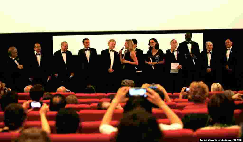 Cartoonists from around the world who appeared in the documentary &quot;Cartoonists, Foot Soldiers of Democracy&quot; attend a press conference.