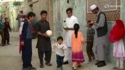 Family Of Afghan Boy With Messi-Signed Soccer Jerseys Flees To Pakistan
