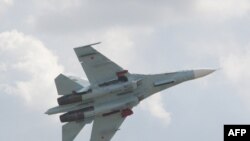 Poland -- Long lens view of the SU-27 fighter plane taken before it crashed killing the two Belarussian pilots in Maleczyn Stary, a small village near Radom, Air Show, 30Aug2009
