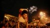 Followers of Shiite cleric Muqtada al-Sadr, seen in the poster, celebrate at Tahrir Square, Baghdad, Iraq, early Monday, May 14, 2018