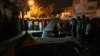 Karachi residents gather around the site of a bomb explosion in that port city in early August.