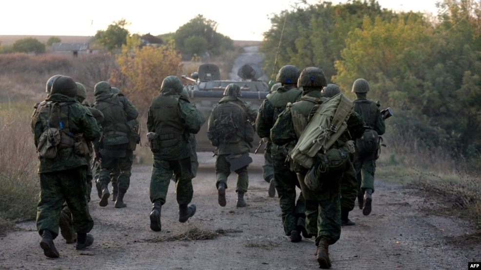 Pro-Russia separatist fighters on the move near Donetsk (file photo)