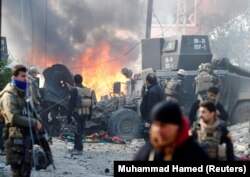 Iraqi Special Operations Forces react after a car bomb exploded during an operation to clear the al-Andalus district of Mosul of Islamic State militants on January 16.